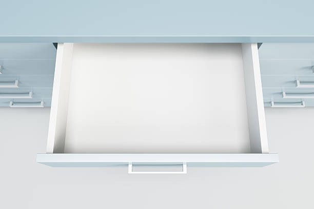 cupboard with opened drawer stock photo