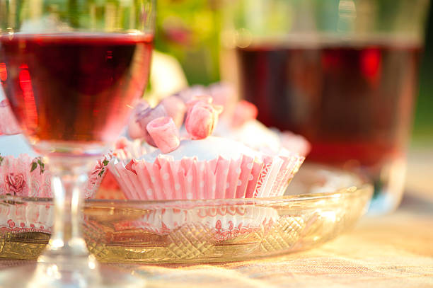 Cupcakes and red wine. stock photo
