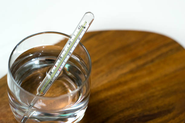 Cure the disease, measure temperature by thermometer and take the pills. Top view stock photo