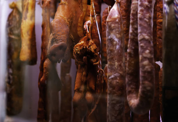 Cured sausage hung stock photo