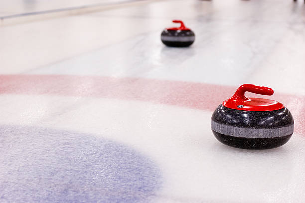 curling rocks on the ice - curling stockfoto's en -beelden
