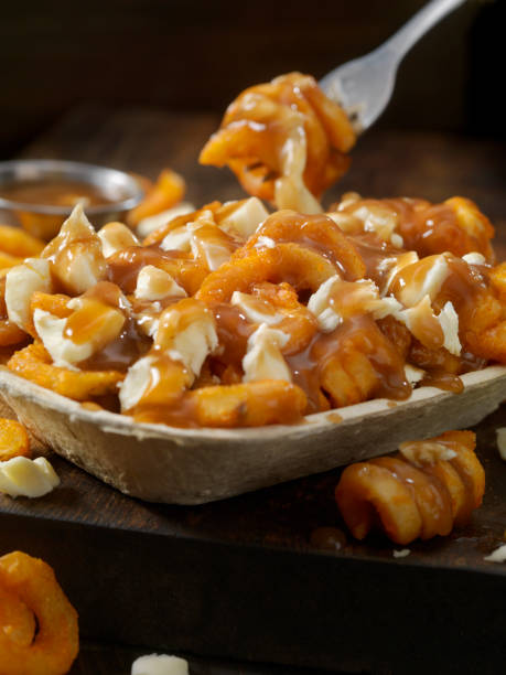 Poutine Stock Photos, Pictures & Royalty-Free Images - iStock