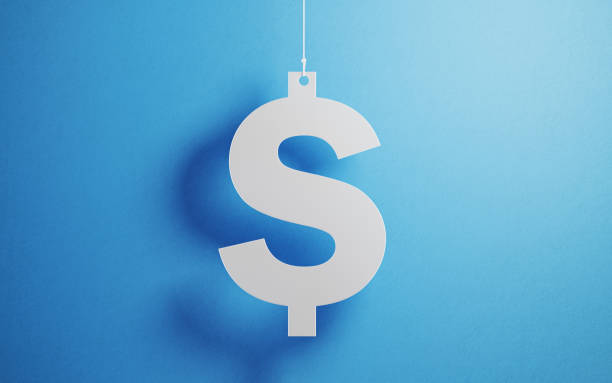 Currency Concept - White American Dollar Sign With String Over Blue Background White American dollar sign with string hanging over blue background. Horizontal composition with copy space. currency photos stock pictures, royalty-free photos & images