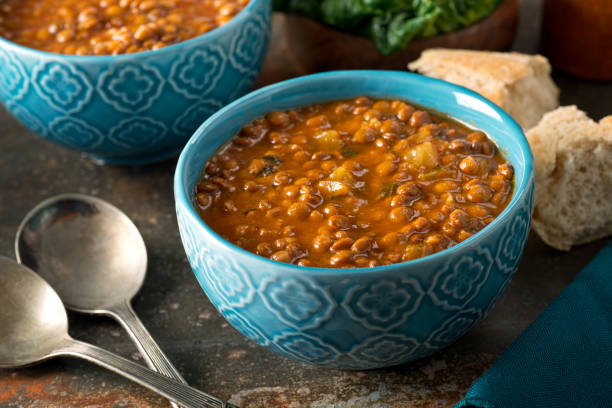 Curried Lentil Soup A bowl of delicious hearty homemade curried lentil soup. lentil stock pictures, royalty-free photos & images
