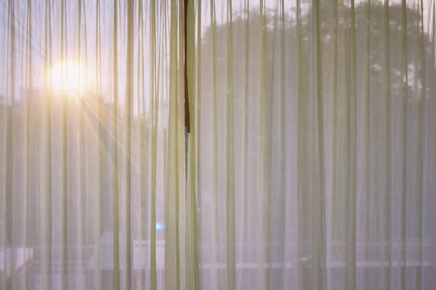 curtain at window with sun stock photo