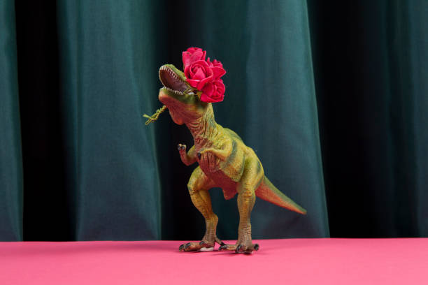 curtain dinosaure eating red roses flower stock photo