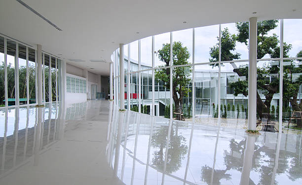 Curve glass wall in the modern building Curve glass wall in the modern building background courtyard stock pictures, royalty-free photos & images