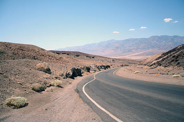Curved Mountain Road - Asphalt direction stock photo