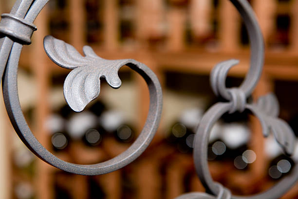 A curved wrought iron bar with leaf details stock photo