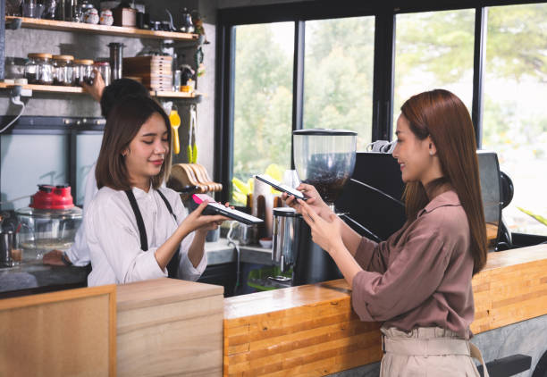 Customer order the hot coffee and payment with smartphone scan. stock photo