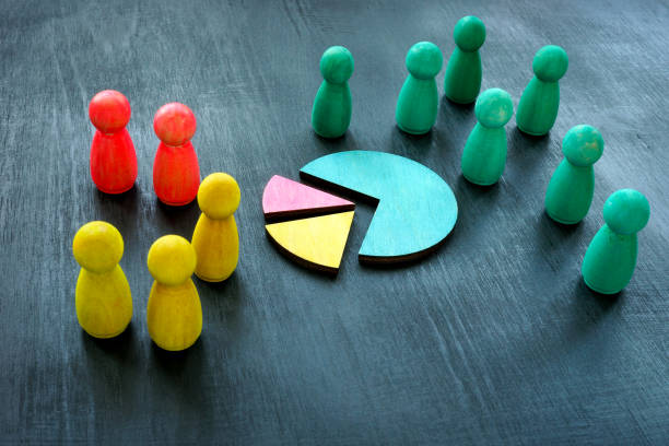 Customer segmentation concept. Color figurines and charts as symbol of market. stock photo