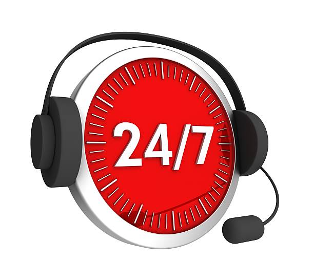 Customer service headset on a red-faced clock with 24/7 stock photo
