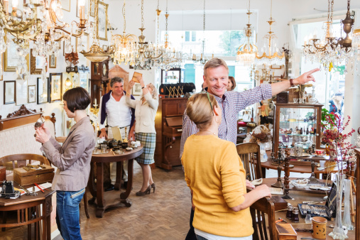 Many customers in an antique store in Berlin, Germany.