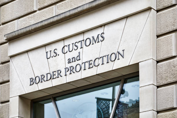 US Customs and Border Protection Sign Washington DC, USA - September 14, 2018: Sign above the entrance to the US Customs and Border Protection building  on 14th Street border patrol stock pictures, royalty-free photos & images