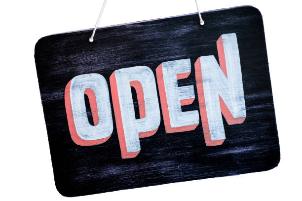 Cut Out Hand Painted Open Sign A cut out and isolated hand painted open sign signifying that a business is open open signage stock pictures, royalty-free photos & images