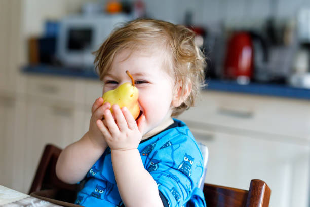 17,855 Baby Eating Fruit Stock Photos, Pictures & Royalty-Free Images -  iStock