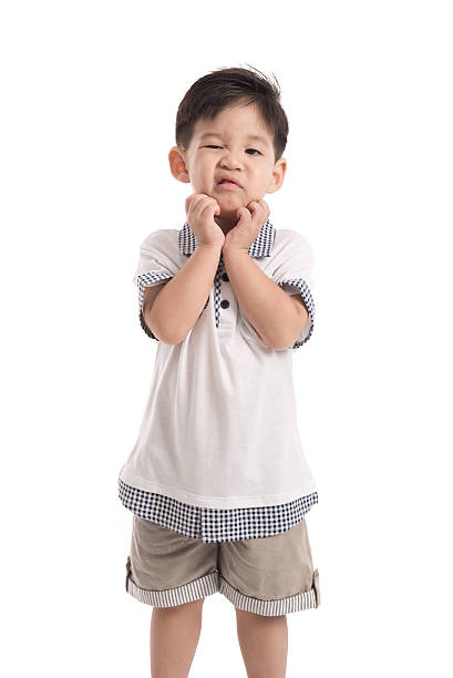 Cute asian child scratching Cute asian child scratching on white background isolated child korea little girls korean ethnicity stock pictures, royalty-free photos & images