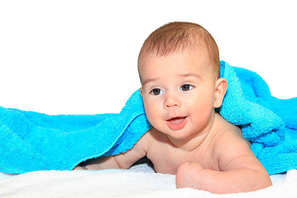 Cute Baby boy lying down isolated stock photo