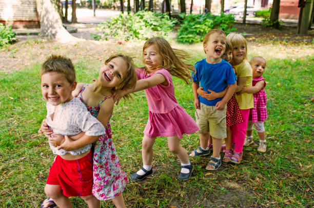 Cute Children Playing At Park stock photo