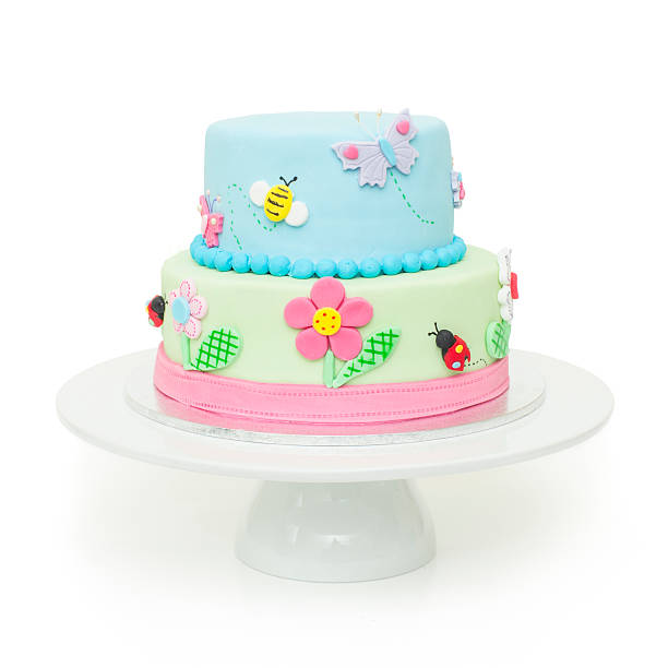 Cute garden themed birthday cake stock photo