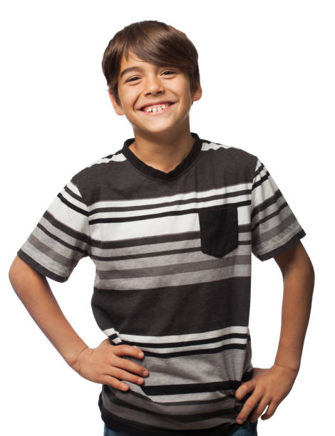 Cute hispanic boy smiling at camera with hands on waist Cute hispanic boy smiling at camera with hands on waist 8 9 years stock pictures, royalty-free photos & images