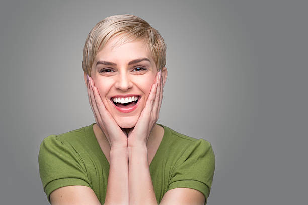 Cute laughing shocked surprised perfect smile white teeth happy dental stock photo