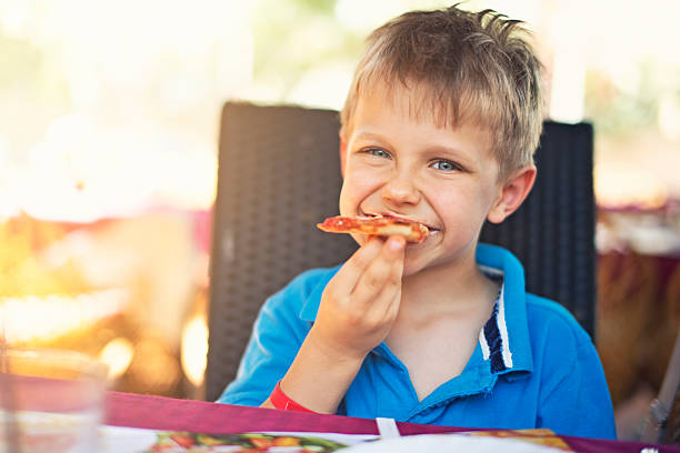Kids Eating Pizza Pictures, Images and Stock Photos - iStock