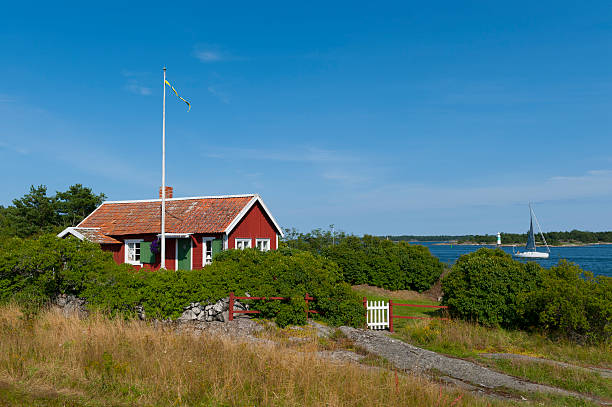 Cute little cottage in the archipelago  swedish flag photos stock pictures, royalty-free photos & images