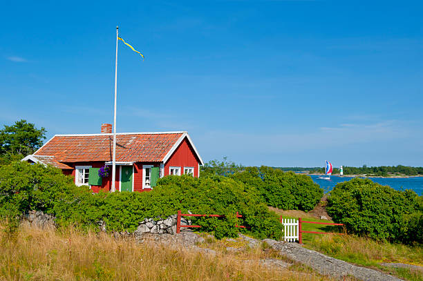 Cute little cottage in the archipelago A cute little cottage, overlooking the sailboats at sea. swedish flag photos stock pictures, royalty-free photos & images