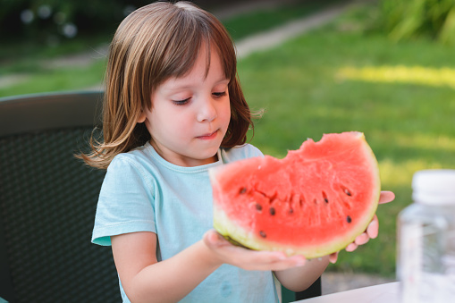 Cute Little Girl Eating Watermelon Stock Photo - Download Image Now - 4 ...