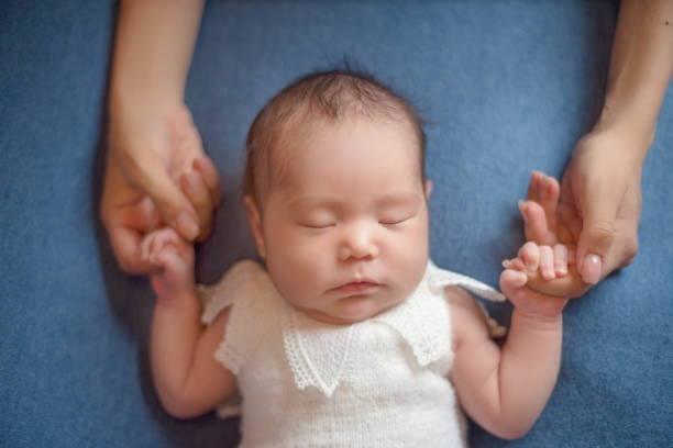 Cute little newborn baby girl stock photo