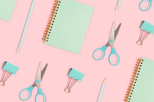 Cute school equipment pattern on a pink background. Office supplies layout.