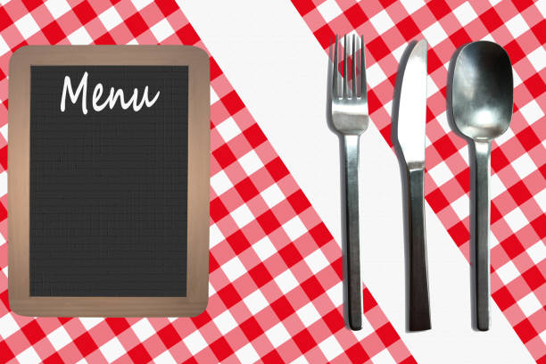 Cutlery on a gingham tablecloth  Set table  Restaurant  Menu tablet stock photo