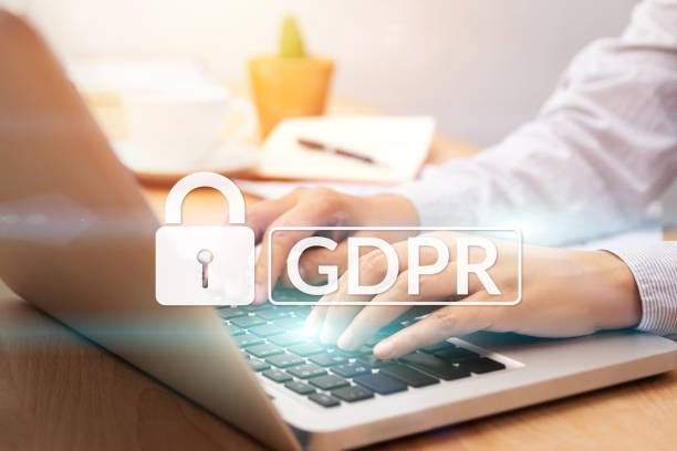cyber security and privacy concept. people using personal computer with text GDPR or General Data Protection Regulation text secure with a padlock logo. stock photo