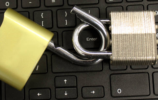 cyber security concept with open lock on keyboard stock photo