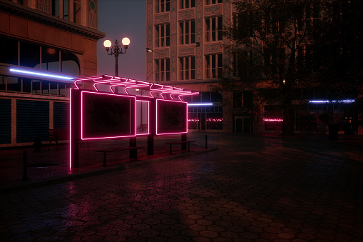 Cyberpunk Style Street In The Dark City With Neon Lighting On Building Exteriors And Bus Stop.