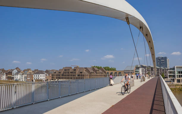 Cyclist and pedestrians on the new Hoge Brug bridge in Maastricht stock photo