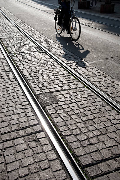 Cyclist on Tram Track stock photo