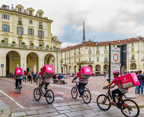 Cyclists of a food delivery service in Turin (Piedmont, Italy).
