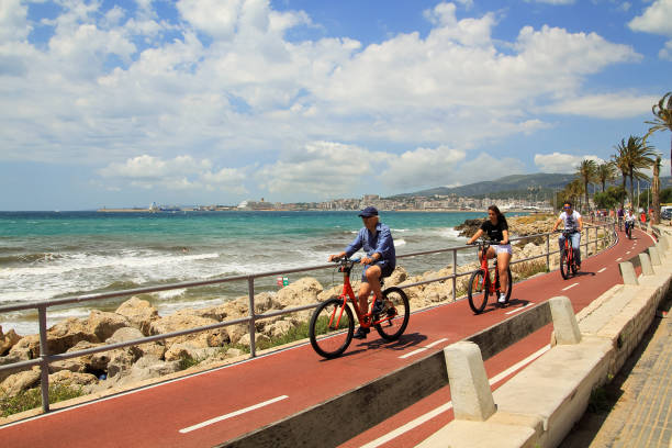 Cyclists riding on the seafront of the Palma de Mallorca. stock photo