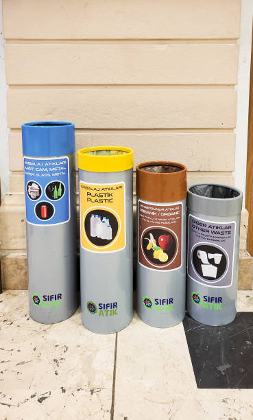 Cylinder shaped trash bins for differentiate sorted garbage to recycling stock photo