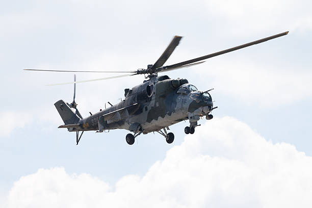 Czech Mil Mi - 24 Hind attack helicopter Berlin, Germany - June 3, 2016: Czech Mil Mi - 24 Hind attack helicopter flies on ILA in berlin, germany on june 3, 2016. michigan shooting stock pictures, royalty-free photos & images