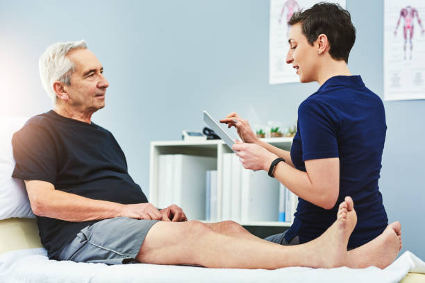 I'd like to see you for a follow up Shot of a young physiotherapist assisting a senior patient in recovery doctor of physiotherapy online stock pictures, royalty-free photos & images