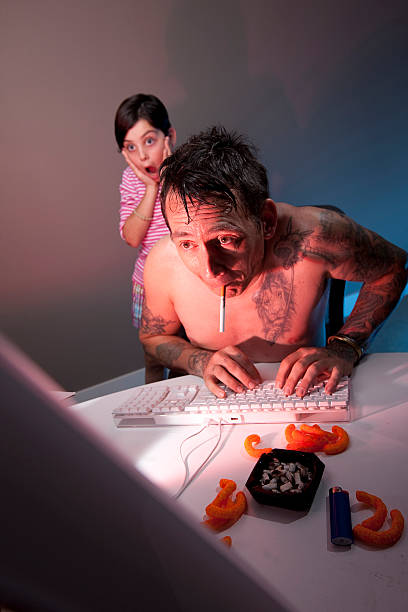 Dad caught surfing adult porn site daughter shocked by what father is looking at on his computer, red and blue gels employed to create drama. porn for free stock pictures, royalty-free photos & images