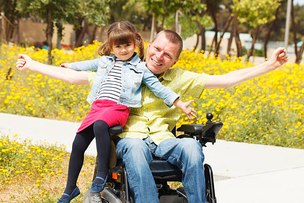 Dad  showing freedom with his little daughter. stock photo
