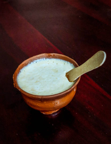 Dahi Sweet curd or sweet dahi in hindi, served in earthen pot, selective focus is used. bengali sweets stock pictures, royalty-free photos & images