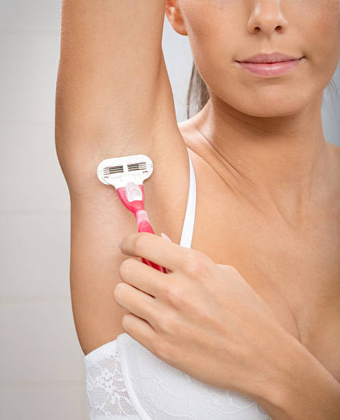 Daily Body Care, Beautiful Woman Shaving Natural Beauty shaving her Arm Pit. Nikon D800e. Converted from RAW. shaved armpits stock pictures, royalty-free photos & images