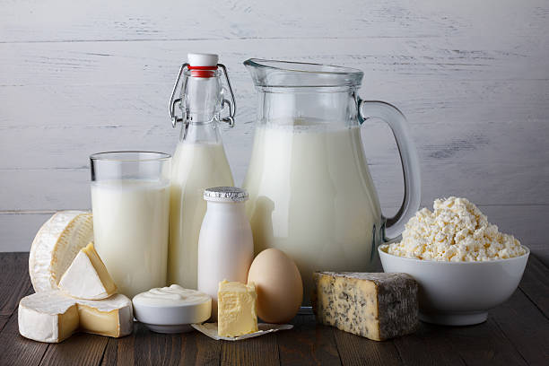 Dairy products on wooden table Dairy products on wooden table still life calcium stock pictures, royalty-free photos & images