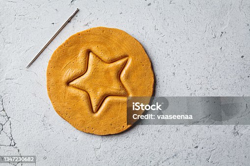 istock Dalgona Candy - South Korean treat. Round sugar cookie with star inside. 1347230682
