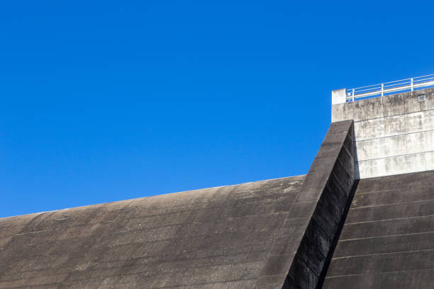 Dam wall and blue sky at Tinaroo Falls Dam in Queensland, Australia stock photo
